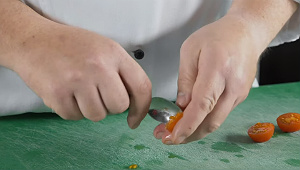 Spoon the seeds out of the tomatoes