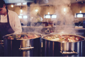 Stock pots in a busy kitchen