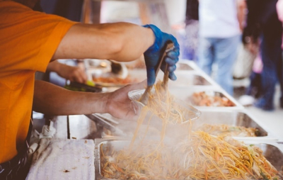 Noodles being served from a festival catering van