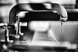 A Dripping Tap That Has Not Been Properly Tightened, Causing Large Water Wastage Every Day