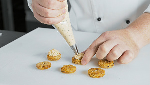 Pipe the mousse on to the rye bases