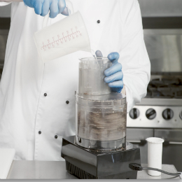Chef Chris John blitzes the ingredients in a food processor