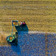 Farming machinery on farm aerial view