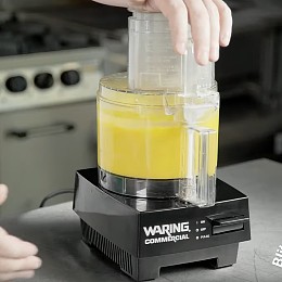 Chef Chris John blitzes the ingredients in a food processor