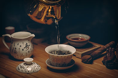traditional japanese tea service with loose leaf tea and brass tea pot