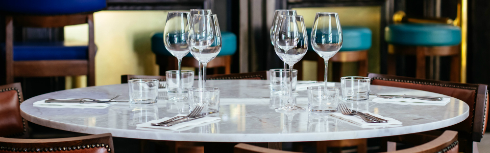 Wine glasses on table in restaurant How to Store & Care for Glassware article