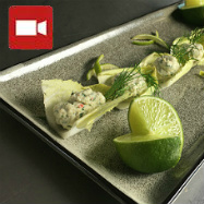 A mousse made of lobster, crayfish and dill sat on a chicory leaf