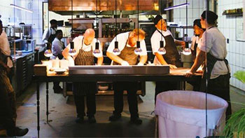 Chefs Prepare Food in Open Plan Kitchen
