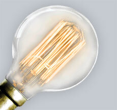 A Globe-Shaped Light Bulb A Globe Light Bulb Great For Pendants and Chandeliers
