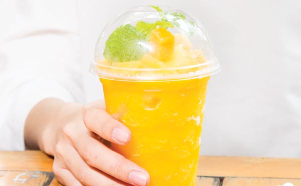 lifestyle shot of the coffee cups  stacked with bio-plastic lid