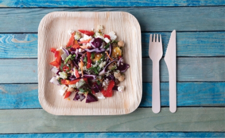 Lifestyle shot of wooden plate and crockery